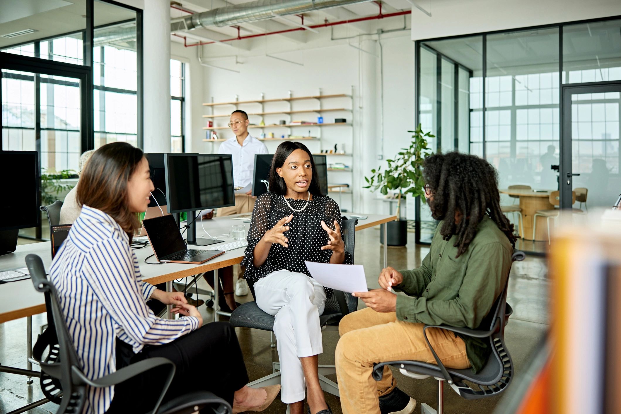Creative team discussing ideas in a modern office